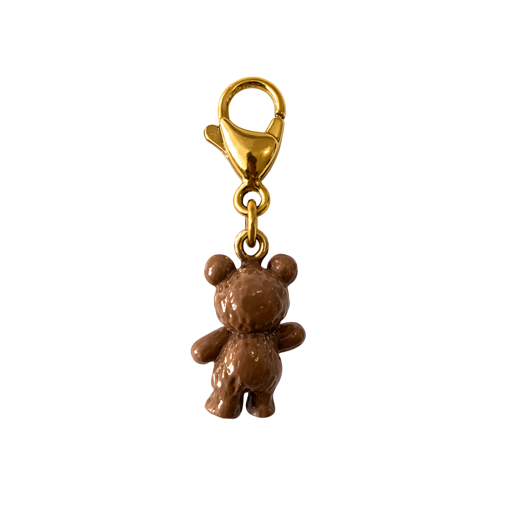 Brown teddy bear charm with gold clasp on a white background