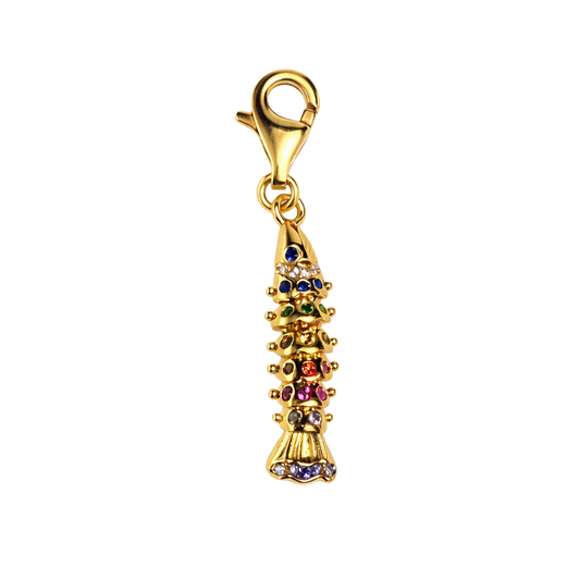 Gold charm with colorful stones on a white background