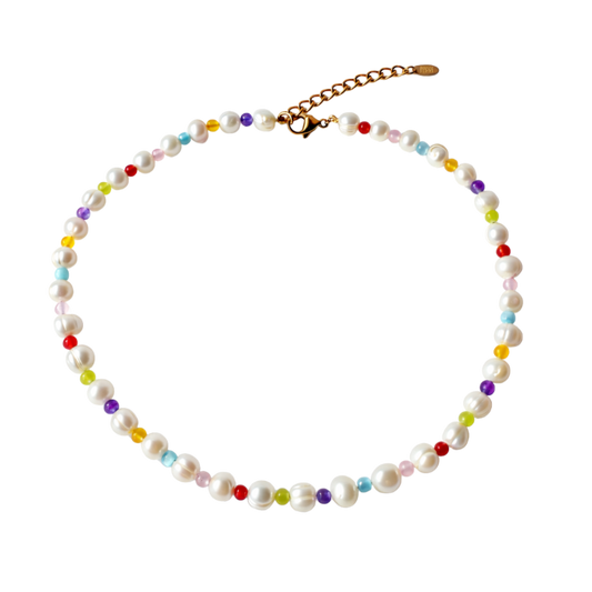 Necklace with pearls and multicolored beads on a white background