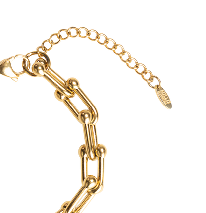 Gold chain bracelet on a white background