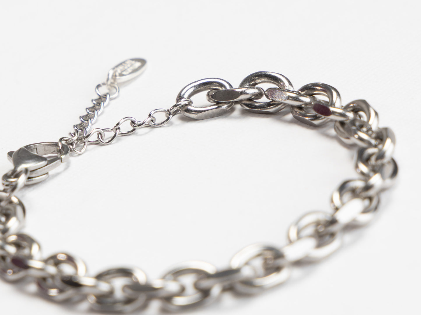 Silver chain bracelet on a white background