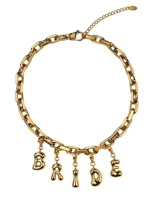 A gold-tone chunky chain millie madness necklace with dangling letter charms spelling 'B R I D E', shown on a plain white background.