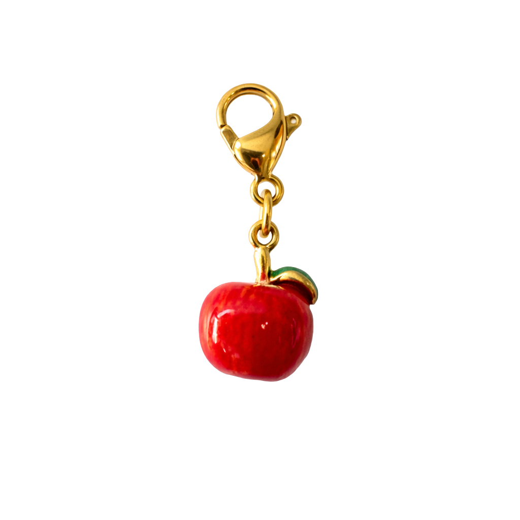 Red apple charm with gold clasp on a white background