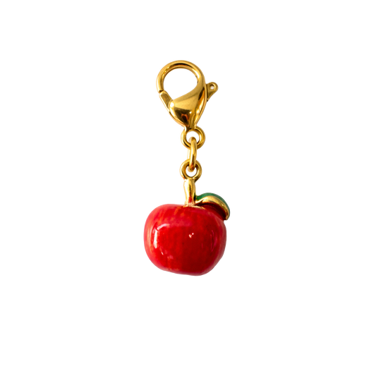 Red apple charm with gold clasp on a white background