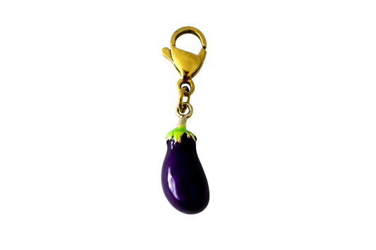 Purple eggplant-shaped charm with a gold clip on a white background