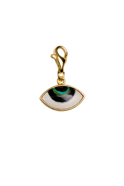 Gold pendant with eye design on a white background