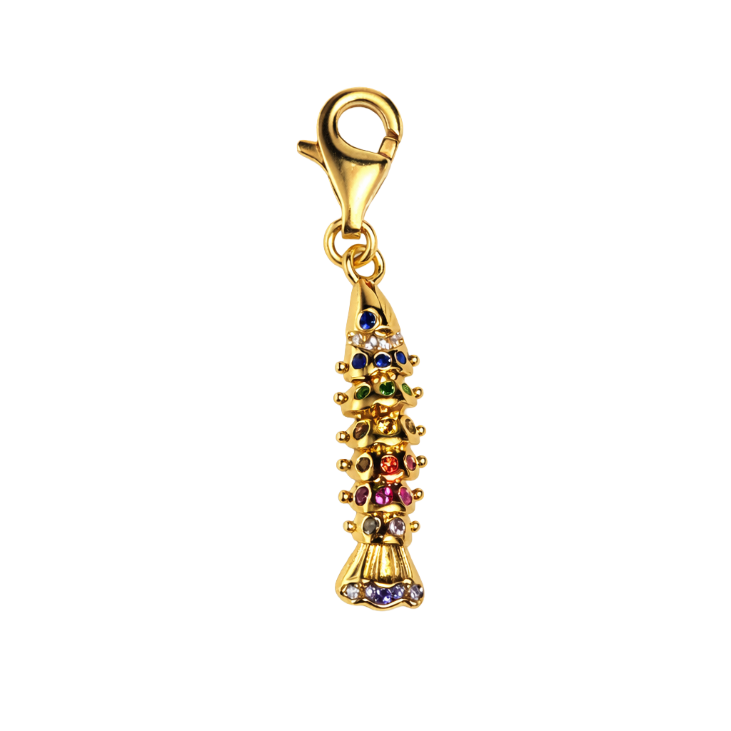 Gold charm with colorful stones on a white background