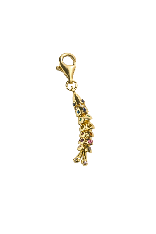Gold fish-shaped pendant with colorful stones on a white background