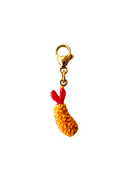 crispy shrimp charm with a gold clip on a white background