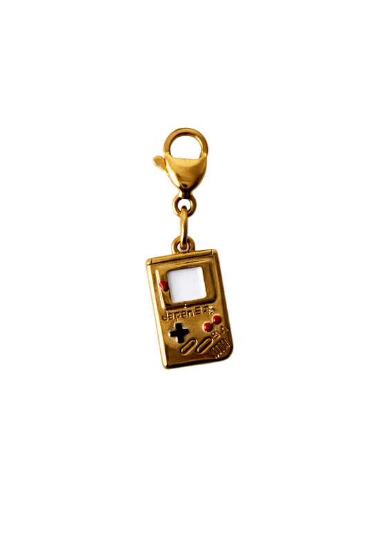 Gold game console charm with a lobster clasp on a white background