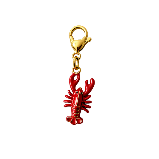 Red lobster charm with gold clasp on a white background