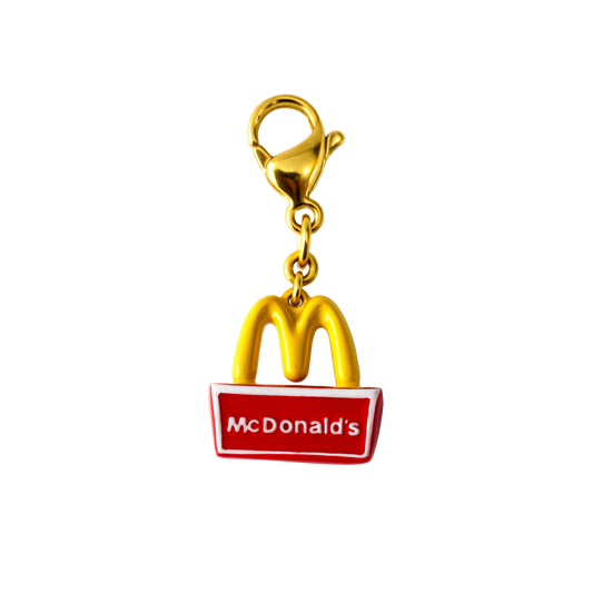 Gold McDonald's logo charm on a white background