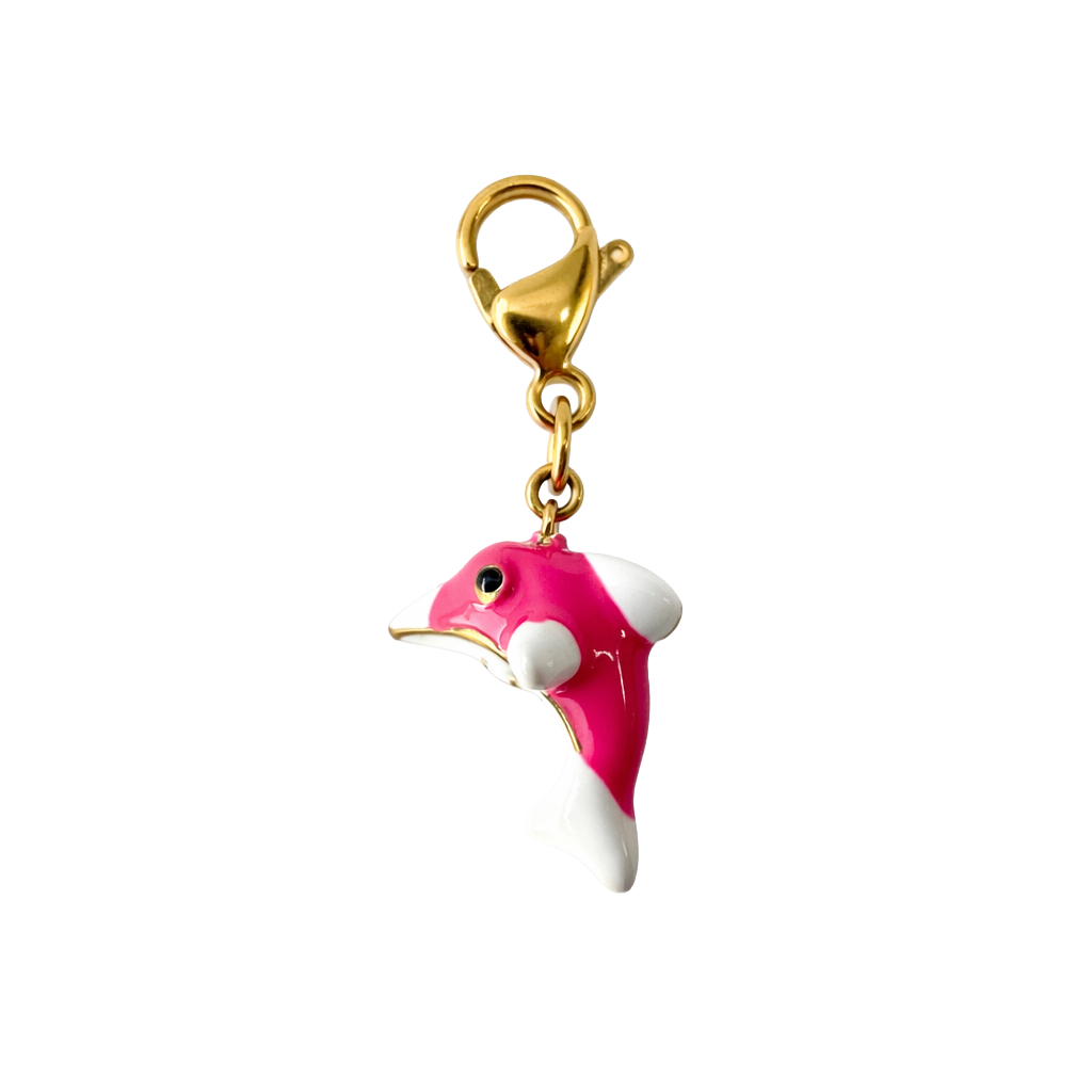 Pink and white dolfin charm with gold clasp on a white background