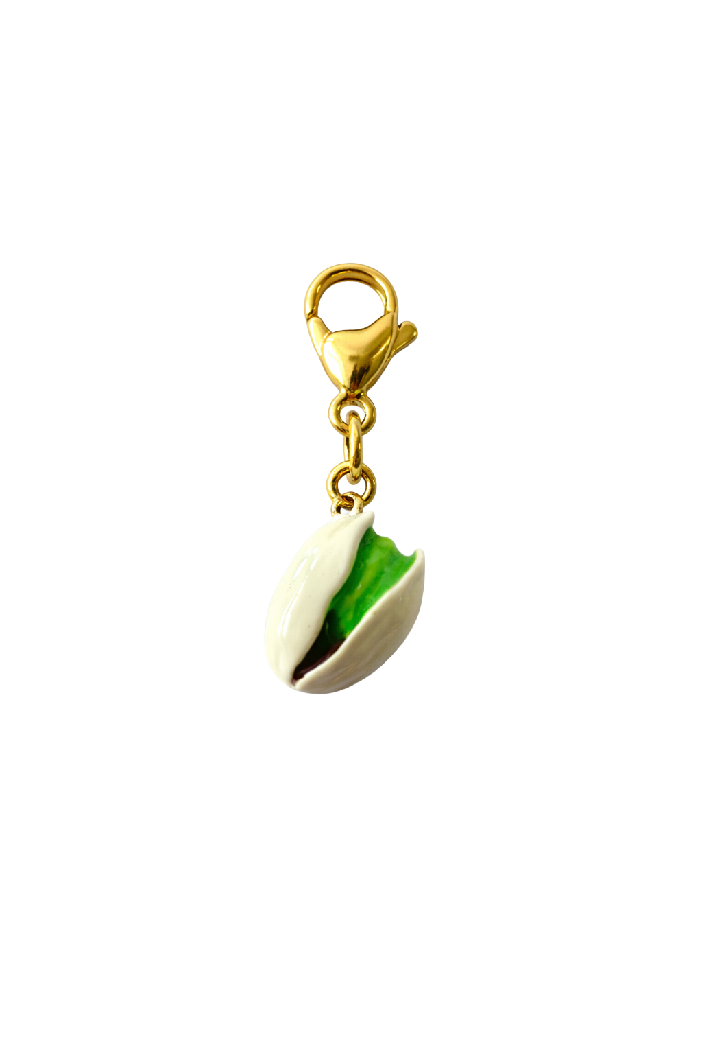 Pistachio-shaped charm with a gold clasp on a white background
