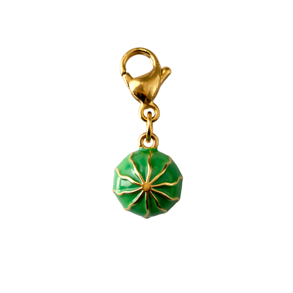Gold and green watermelon charm on a white background