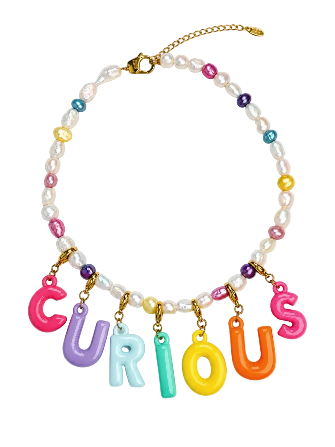 A colorful MILLIE MADNNESS statement necklace featuring the word 'CURIOUS' spelled out in vibrant, glossy letter charms in pink, purple, light blue, mint green, yellow, and orange. The necklace is accented with white faux pearls, small multicolored beads, and gold-tone metal hardware, including a lobster clasp and extension chain, set against a plain white background.