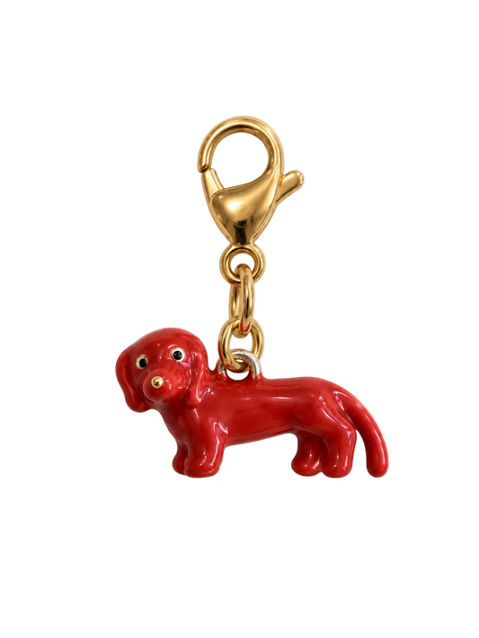 A glossy red dachshund-shaped charm keychain with a gold-tone lobster clasp and chain, shown on a plain white background.