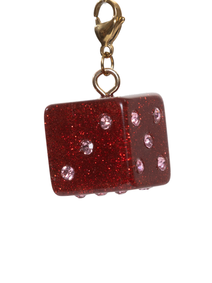 Red glittery dice charm with gold clasp on a white background