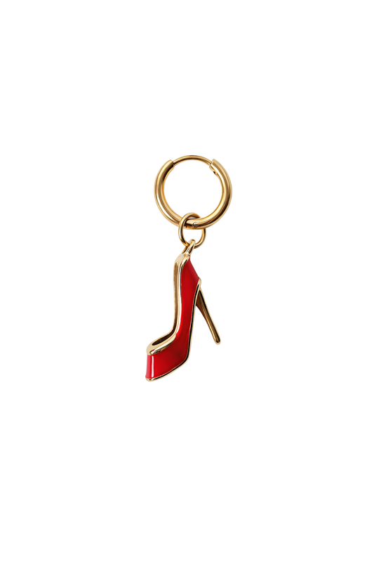 Gold bird-shaped earring on a white background