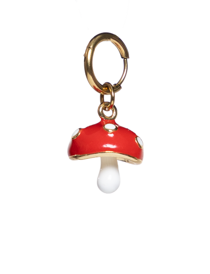 Red mushroom charm with a gold cap on a white background