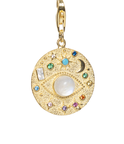 Gold pendant with colorful stones on a white background