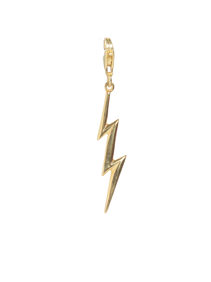 Gold lightning bolt charm on a white background