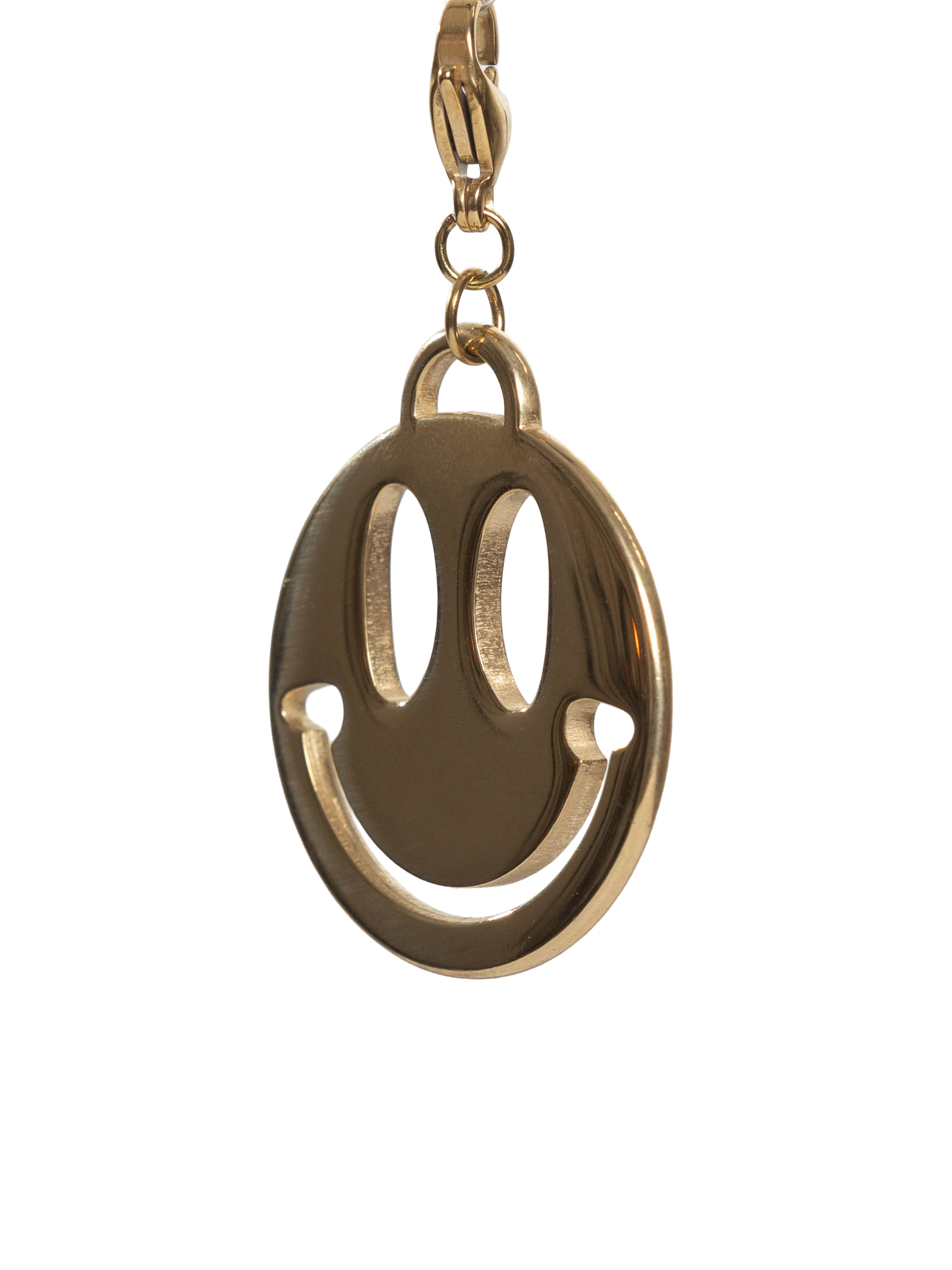 Gold stainless steel smiley face charm on a white background