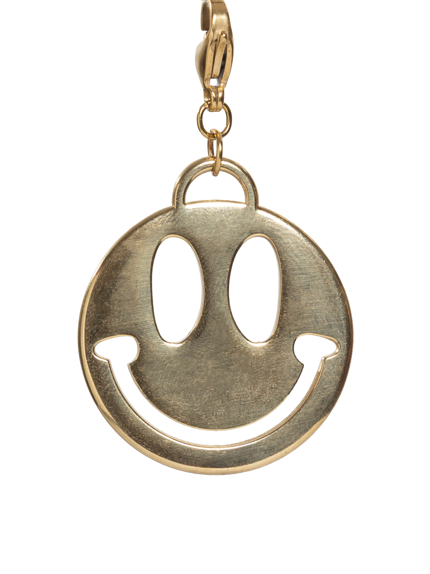 Gold stainless steel smiley face charm on a white background