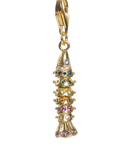 Gold fish charm with colorful stones on a white background