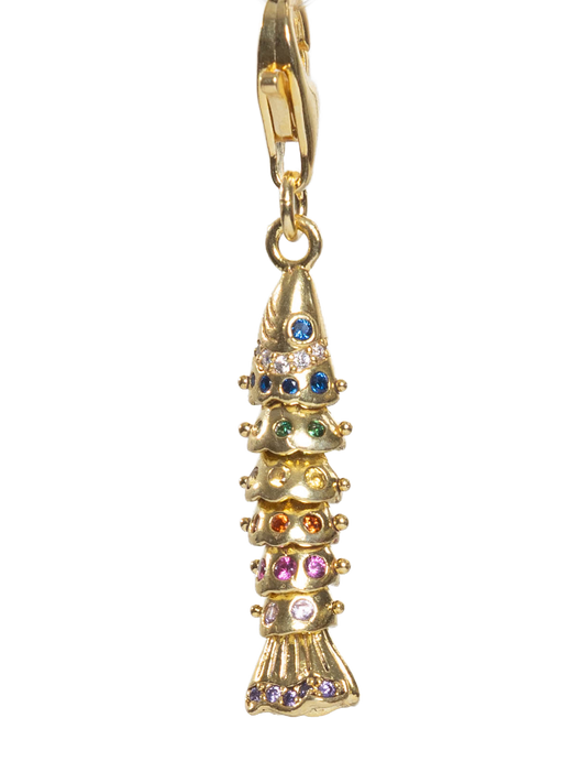 Gold fish pendant with colorful gemstones on a white background