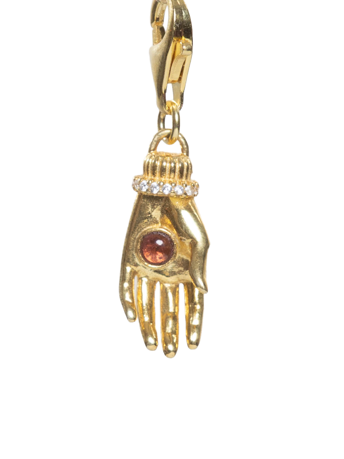 Gold charm shaped like a hand with a brown gemstone on a white background