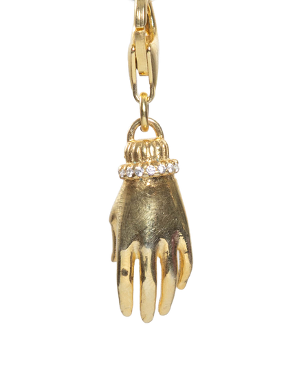 Gold hand-shaped pendant on a white background