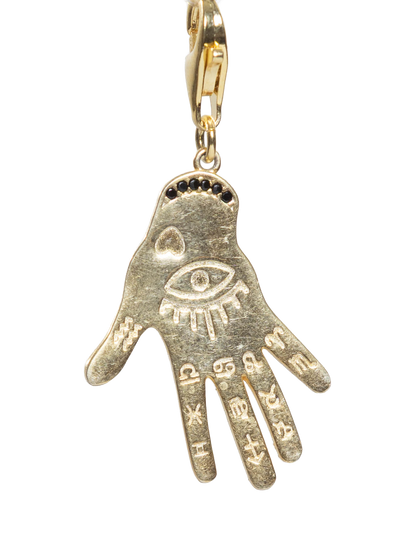Gold hand-shaped pendant with eye design on a white background