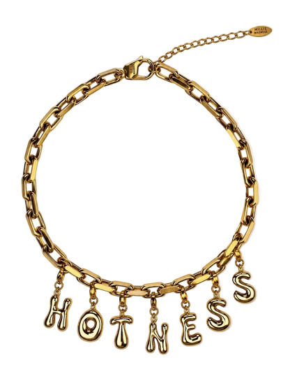 A gold-tone chain millie madness necklace with dangling letters spelling 'HOTNESS' on a clean white background.