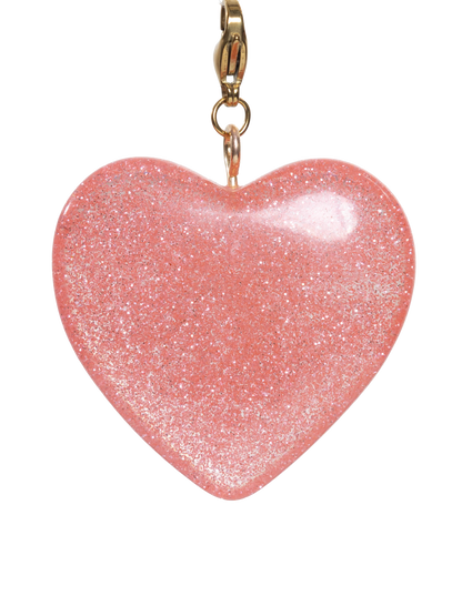 Pink heart-shaped charm with gold clasp on a white background