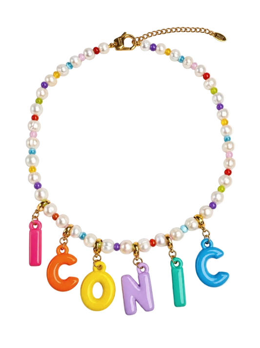 A beaded MILLIE MADNESS necklace with real pearls and small multicolor beads, featuring gold-tone hardware and colorful letter charms spelling 'ICONIC'.