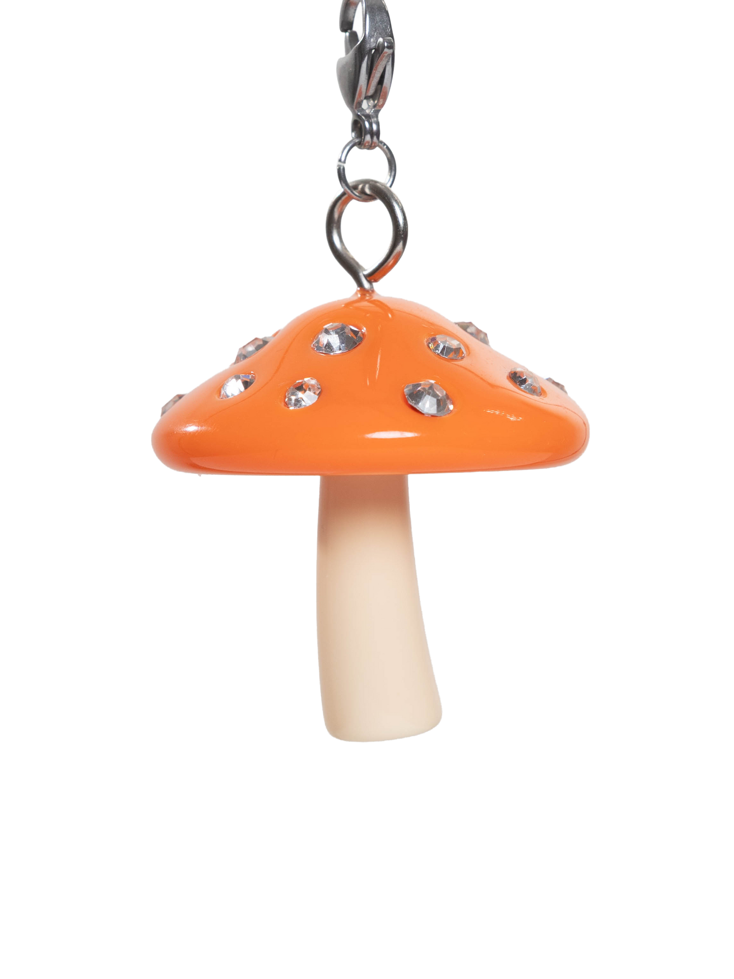 Mushroom-shaped charm with orange cap and white stem on a stainless steel sivler clasp and white background