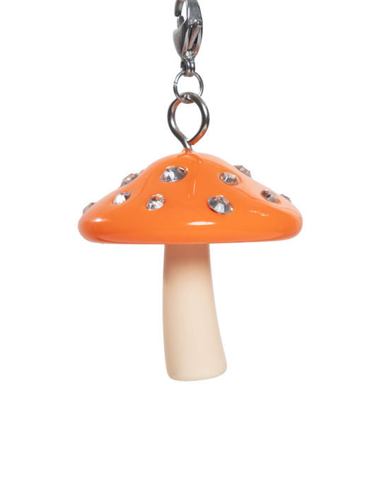 Mushroom-shaped charm with orange cap and white stem on a stainless steel sivler clasp and white background