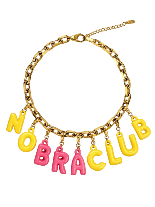 A gold-tone chain Millie Madness necklace with dangling letter charms spelling 'NO BRA CLUB' in alternating yellow and pink letters, shown on a plain white background.