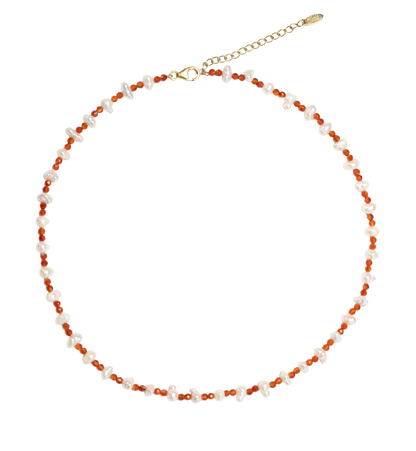 Necklace with small beads semi precious stones and pearls on a white background