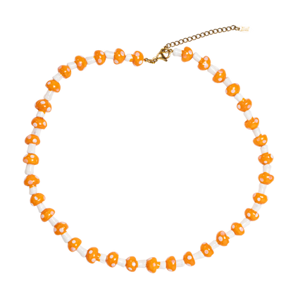 Necklace with orange and white mushroom beads  on a white background