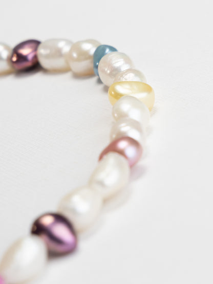 Pearl MILLIE MADNESS NECKLACE with multicolored PEARLS on a light background