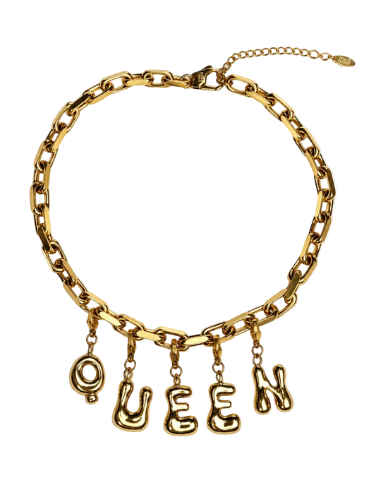 A gold-tone chain millie madness necklace with dangling letters spelling 'QUEEN' on a plain white background.