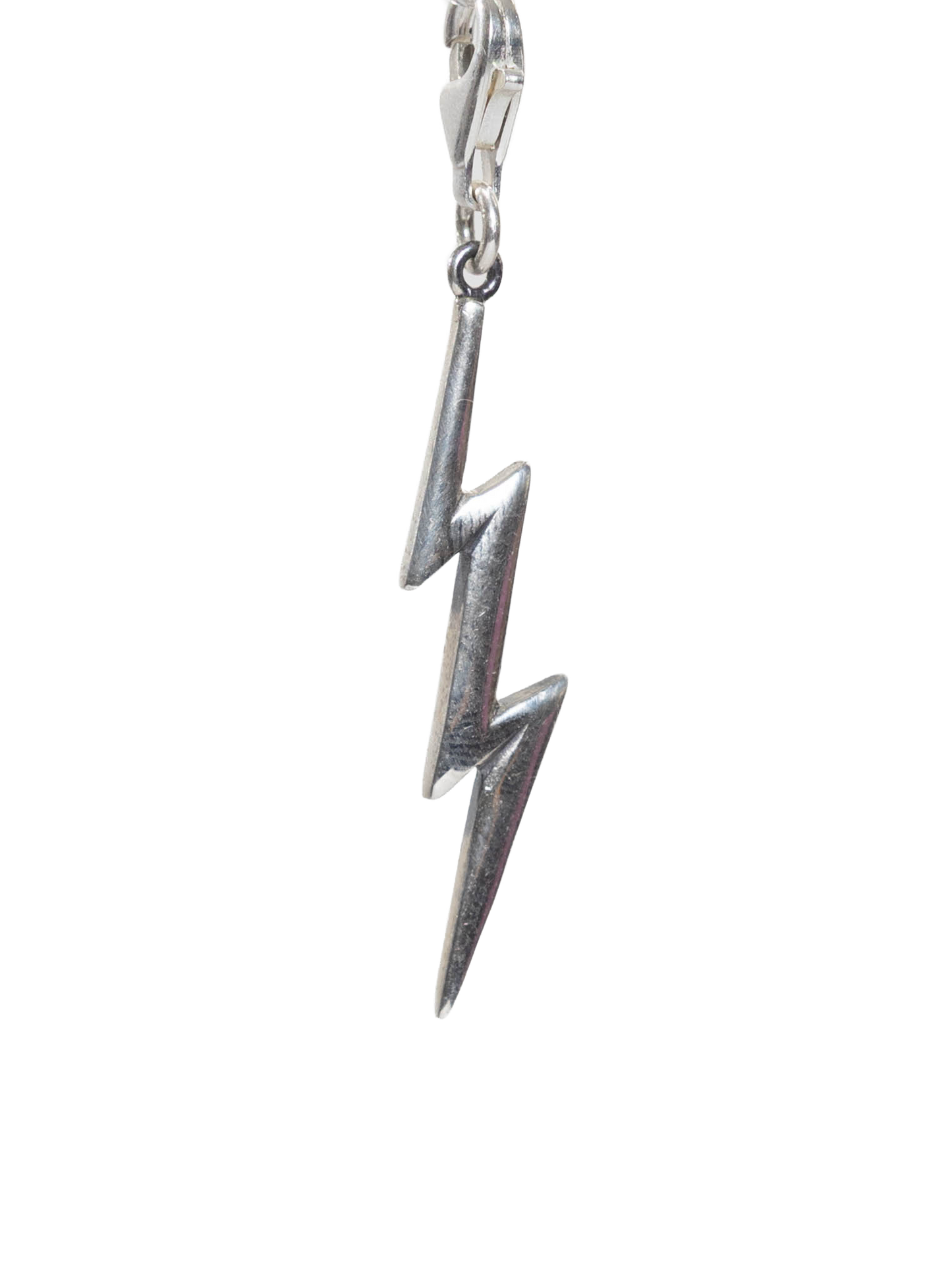 Real Silver lightning bolt charm on a white background