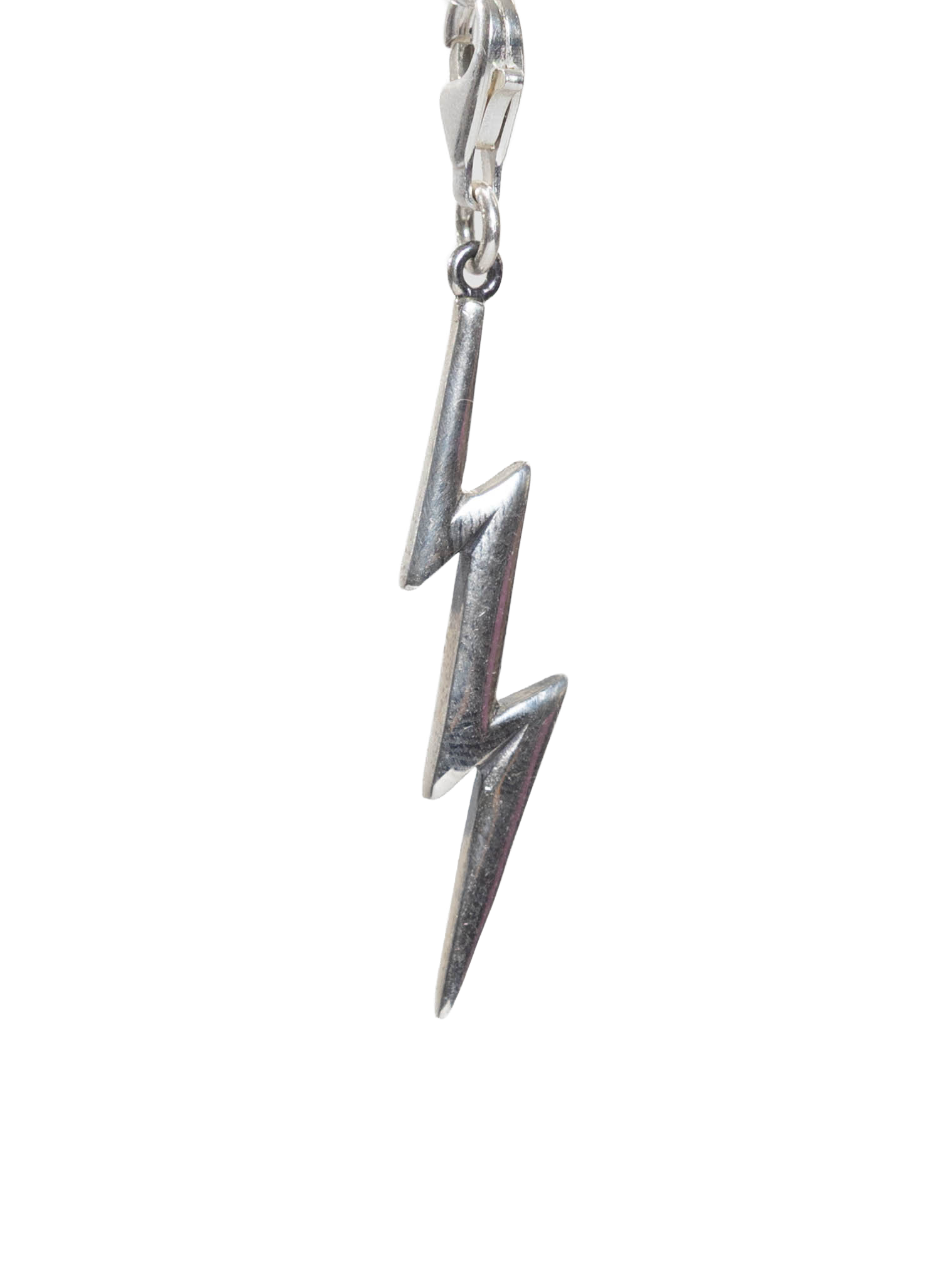 Real Silver lightning bolt charm on a white background
