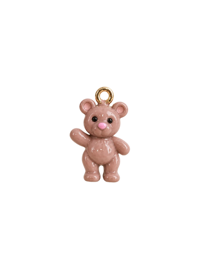 A small glossy pink teddy bear charm with a gold-tone hanging loop at the top, photographed on a clean white background.