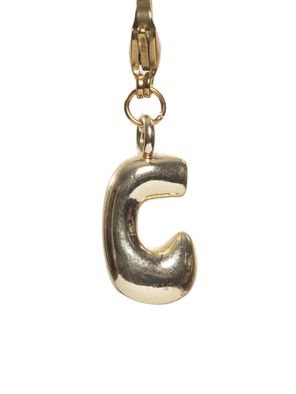 Gold letter 'C' charm on a white background
