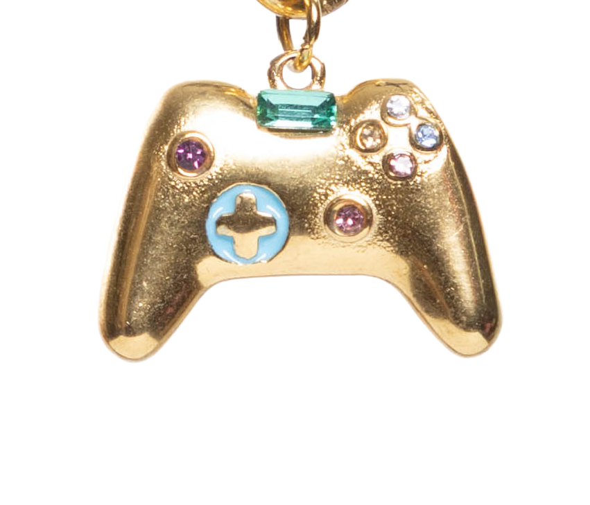 Gold-colored gaming controller charm with colorful stones on a white background