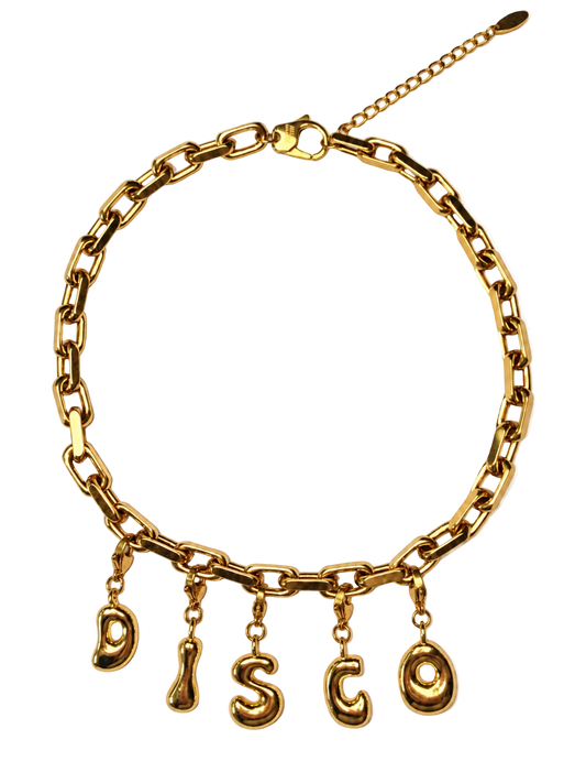 A gold-tone millie madness chain necklace with five dangling letters spelling 'DISCO' on a plain white background.