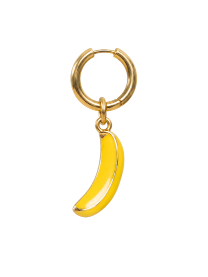 A gold huggie hoop earring with a dangling yellow banana charm, shown on a plain white background.